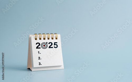 2025 New Year resolutions goal, plan, and action concept. Calendar and Note Pad Happy New year 2025. planning checklis target business and health photo