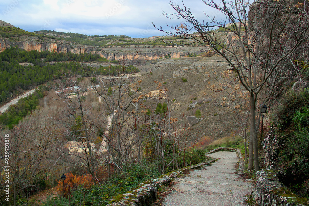 Landscape with a panoramic view of mountains and greenery against a blue sky with clouds in the city of Cuenca, near Madrid, Spain Landscape with a panoramic view of mountains and greenery against a blue sky with clouds in the city of Cuenca, near Madrid, Spain