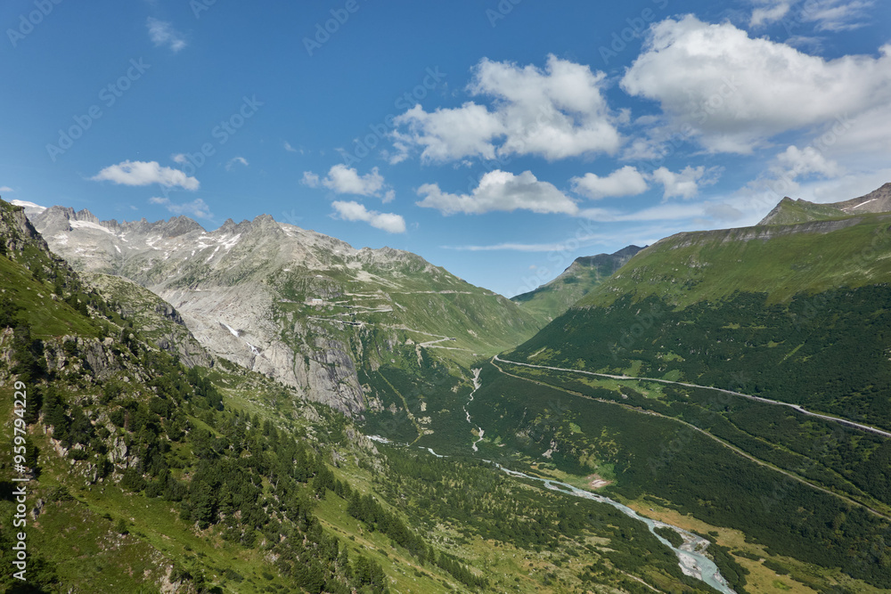 Naklejka premium Road tripping through the Swiss Alps on Grimselpass, with its panoramic views