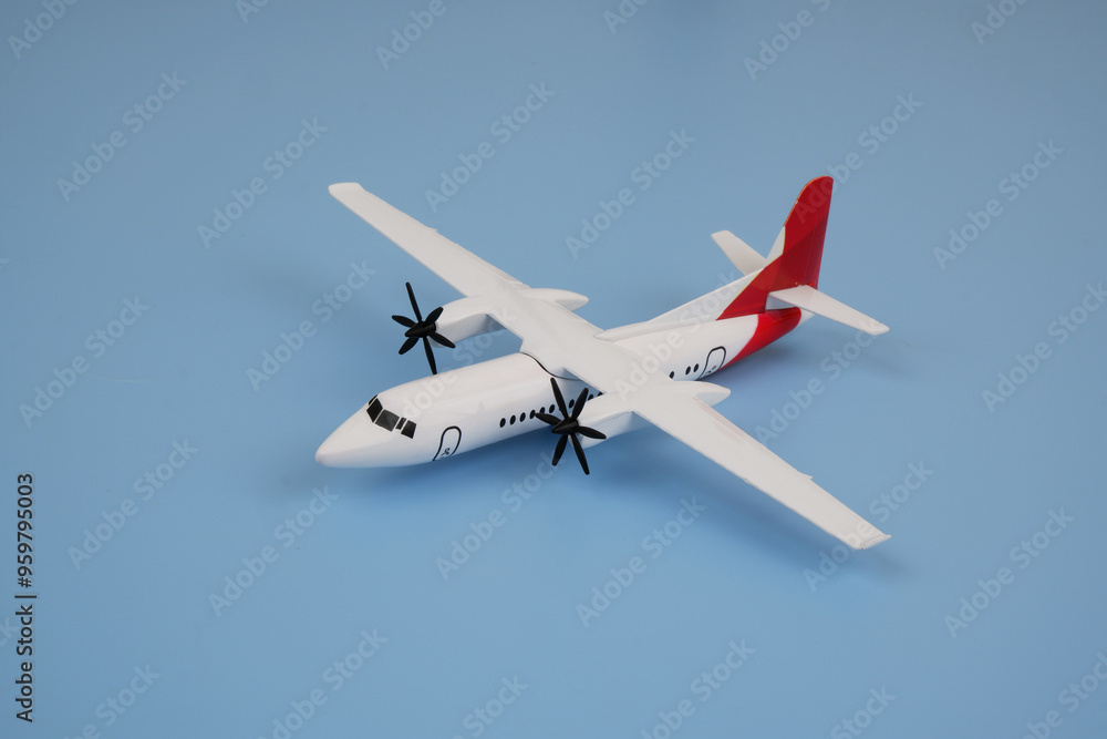 Obraz premium Airplane on blue background. Travel and transportation concept. 
