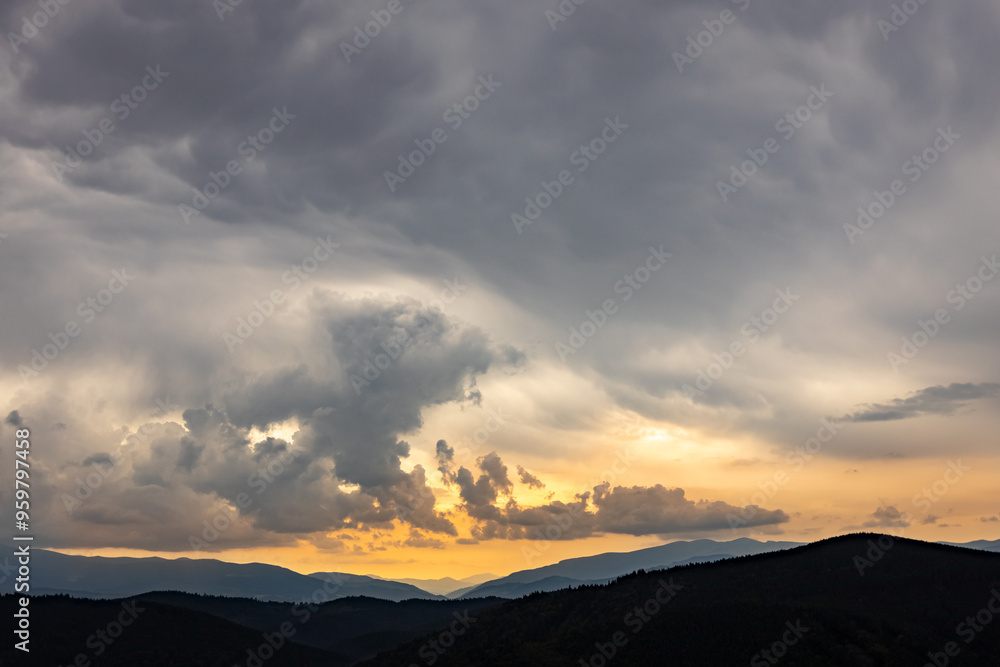 Sunrise in the mountains, panoramic view, mountain peaks with clouds. Sunrise in the mountains, panoramic view, mountain peaks with clouds.