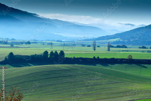 Photos Misty hills and green fields in the Allin Valley, Navarra, Spain