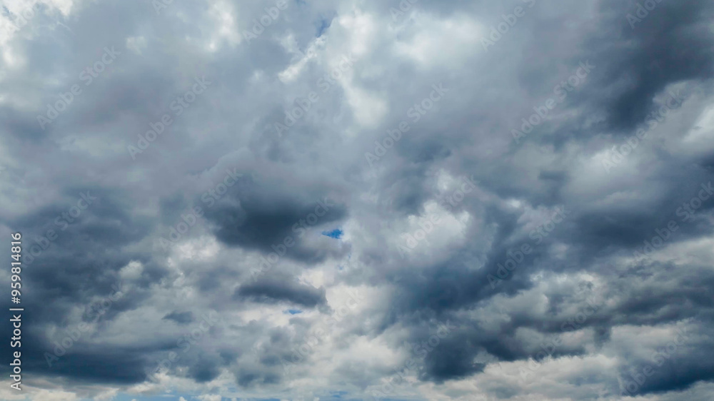 Dramatic storm clouds fill the sky, symbolizing unpredictable weather conditions and natural phenomena Dramatic storm clouds fill the sky, symbolizing unpredictable weather conditions and natural phenomena