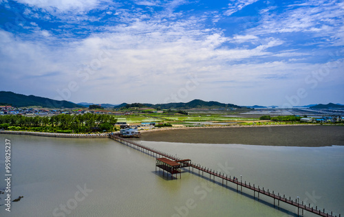 Sinan-gun, Jeollanam-do, South Korea - May 23, 2021: Aerial view of Jjangttungeo Bridge on the sea at low tide with mud flat at Jeungdo Island photo