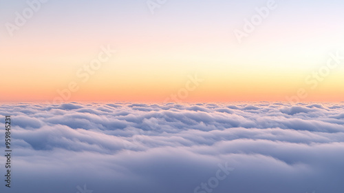 Breathtaking view of the sky at dawn with soft pastel colors blending together as the first light of the sun breaks through the clouds, capturing the serene beauty of a new day.