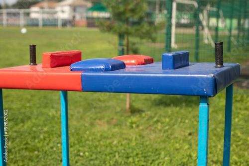 Arm wrestling machine. Sports equipment for arm strength training. Equipment at the wrestling tournament. photo