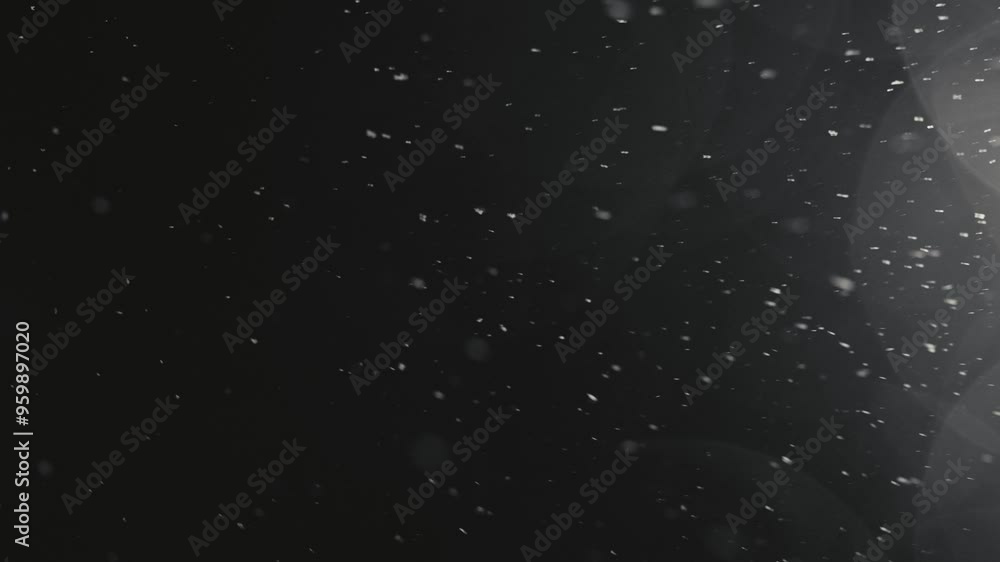 Snowflakes falling through night sky, illuminated against dark background. Winter snowfall Snowflakes falling through night sky, illuminated against dark background. Winter snowfall