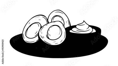 Plate of hard-boiled eggs, sliced in half, beside a small bowl of mayonnaise
