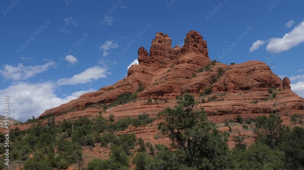 Arizona rock formations from a passing car with blue sky and clouds in the background Arizona rock formations from a passing car with blue sky and clouds in the background