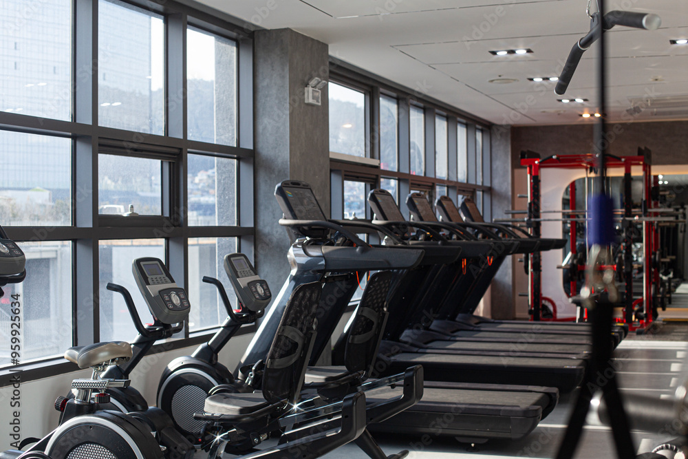 Fototapeta premium Gym Room Fitness Center With Equipment And Machines