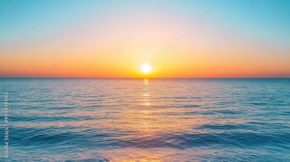 Obraz premium Sunrise over a calm ocean, symbolizing new beginnings and fresh starts