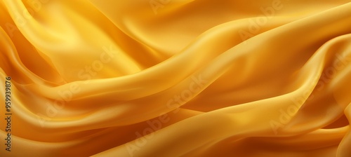 Soft golden silk fabric flows gracefully, capturing sunlight in an elegant display of texture