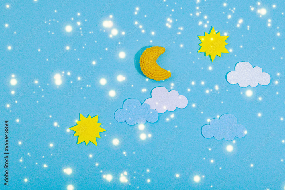 Fototapeta premium Weather symbols concept. Crocheted sun, clouds and moon. Handmade props, hobby, crafted decor