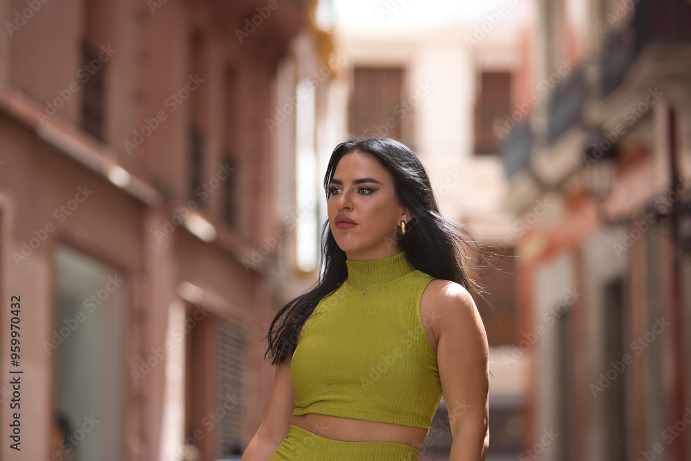 Portrait of a young, beautiful, brunette, Latina woman, wearing a green suit, with a distracted and lost look. Concept beauty, fashion, trend, city. Portrait of a young, beautiful, brunette, Latina woman, wearing a green suit, with a distracted and lost look. Concept beauty, fashion, trend, city.