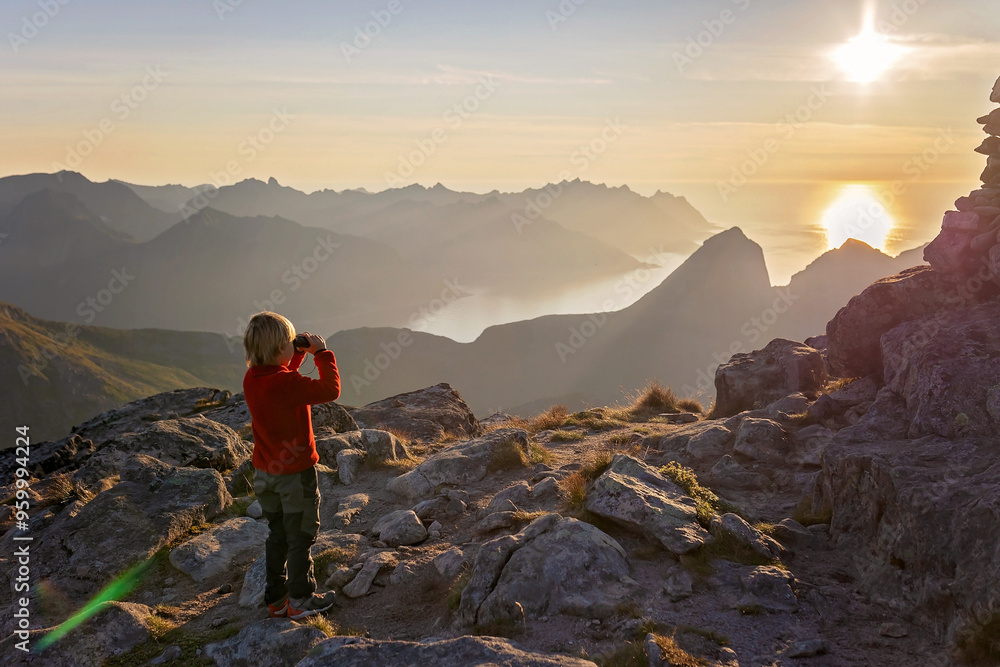 Fototapeta premium Children and adults, family with dog, hiking Grytetippen trail in Senja, Lofoten on a sunny hot summer day