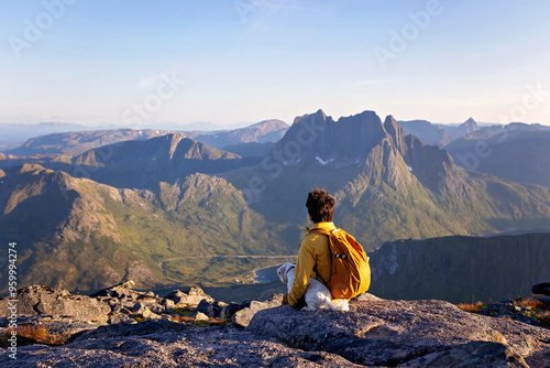 Children and adults, family with dog, hiking Grytetippen trail in Senja, Lofoten on a sunny hot summer day photo