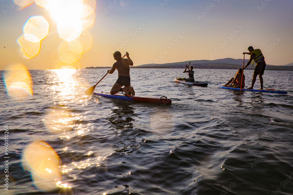 sup surfing in the sea