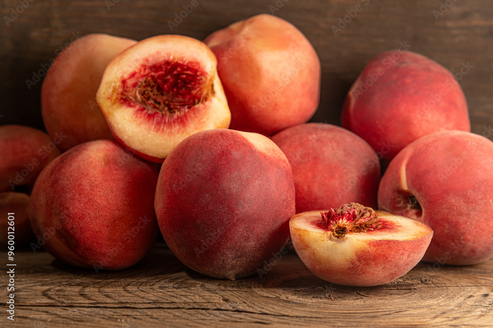 ripe sweet juicy peaches on wooden table close up shallow depth of field ripe sweet juicy peaches on wooden table close up shallow depth of field