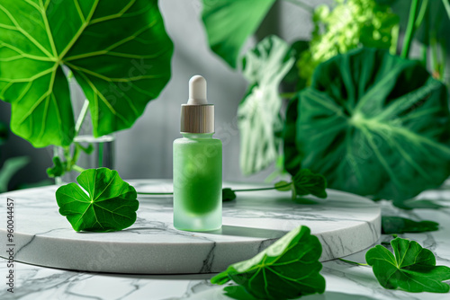 skincare bottle on a marble podium surrounded by centella leaves photo