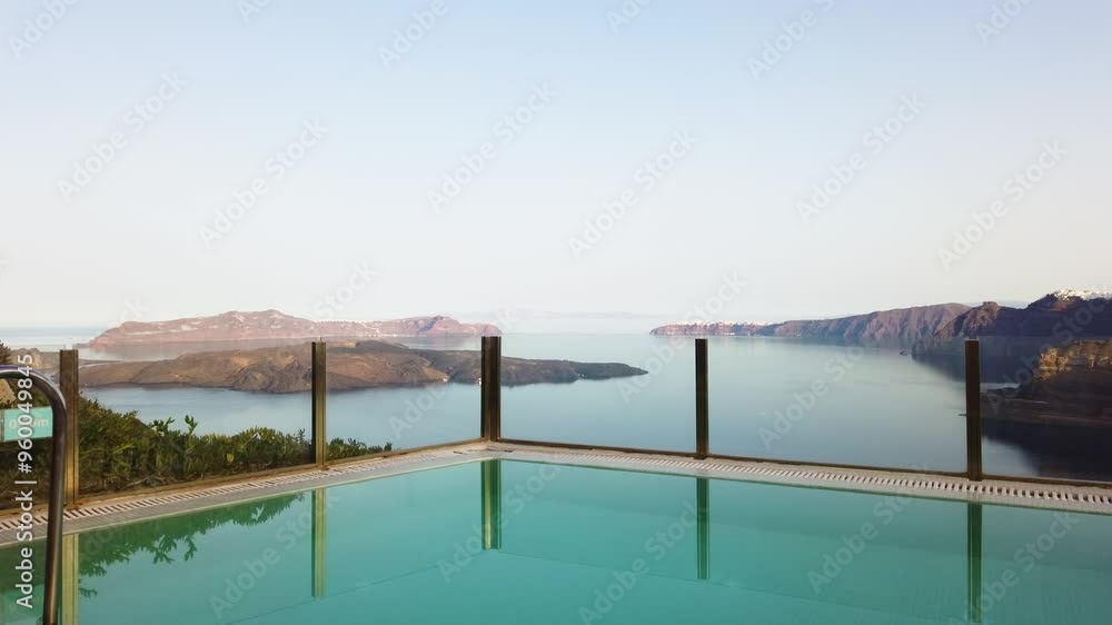 clear pool water and view of Santorini caldera, Greece clear pool water and view of Santorini caldera, Greece