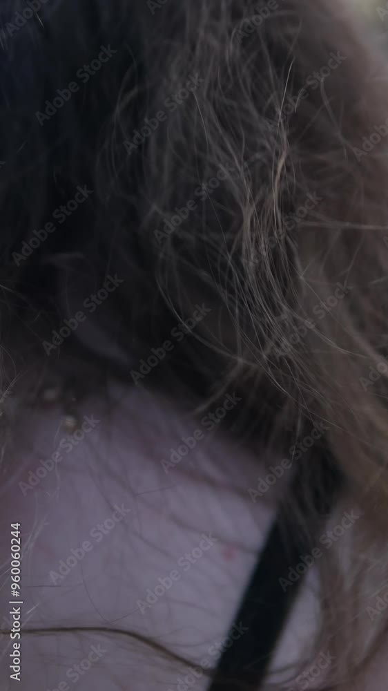 Girl Walking down the street straightens her hair close-up, View from the back, Slow Motion Girl Walking down the street straightens her hair close-up, View from the back, Slow Motion
