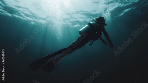 Wallpaper Mural A scuba diver exploring the depths of the ocean, illuminated by beautiful sunlight rays, showcasing the adventure and serenity of underwater exploration. Torontodigital.ca