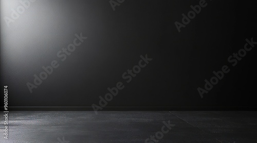 A black room with a wall that is covered in a textured surface