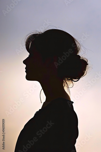 Silhouette portrait of a woman in profile.