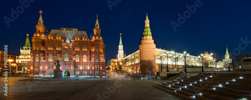 Moscow, Russia. Manezhnaya Square. Evening view of the building of the State Historical Museum and the towers of the Moscow Kremlin. Blurred figures of people in long exposure.