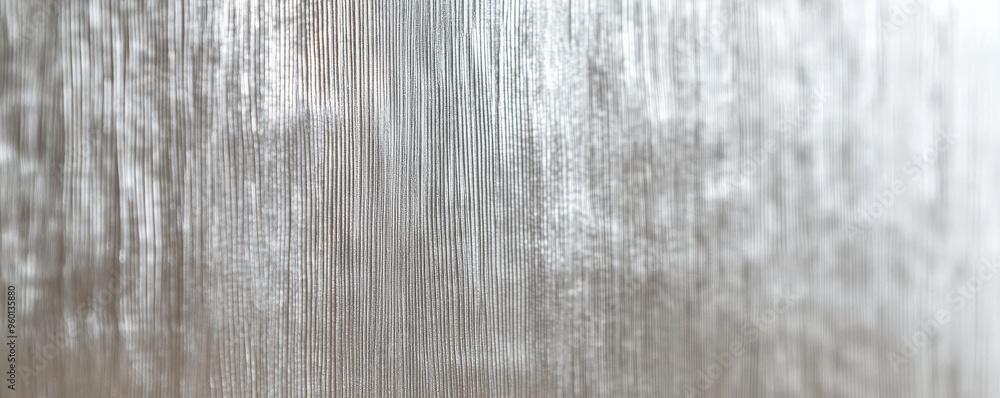 A silver textured surface with a soft, brushed finish, highlighted by fine, linear patterns that add depth and sophistication. A silver textured surface with a soft, brushed finish, highlighted by fine, linear patterns that add depth and sophistication.