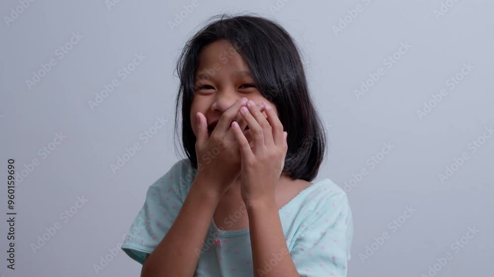 Portrait Funny little asian girl big smiling child looking at camera and pointing her cheeks, enjoying childhood testimonial concept, Positive child, 4k footage, Slow Motion Portrait Portrait Funny little asian girl big smiling child looking at camera and pointing her cheeks, enjoying childhood testimonial concept, Positive child, 4k footage, Slow Motion Portrait