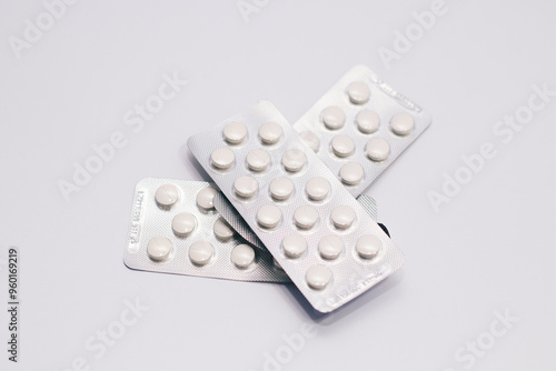 Blister Packs of White Pills on a White Background