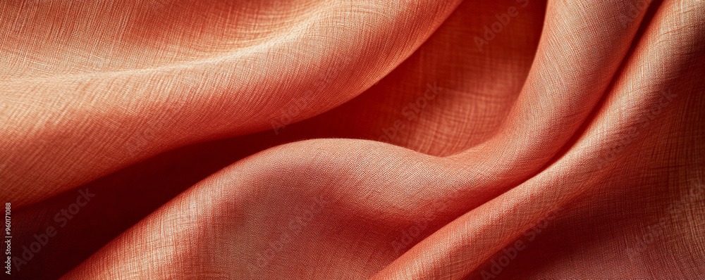 A bright textured surface with a soft, satin-like finish, glowing with vivid, warm tones that create a sense of luxury.