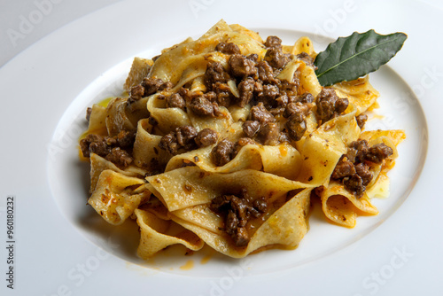 Plate with pappardelle with wild boar ragout sauce with bay leaf