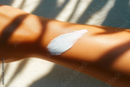 Sunshine Shadows Highlighting Sunscreen Lotion on Skin photo