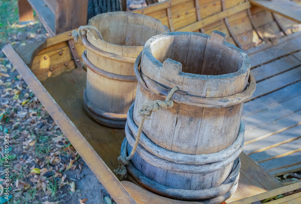 old wooden buckets for water from boards, a couple of vessels old wooden buckets for water from boards, a couple of vessels