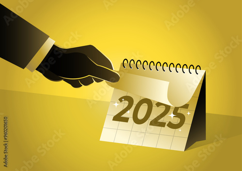 businessman turning page on calendar for the new year