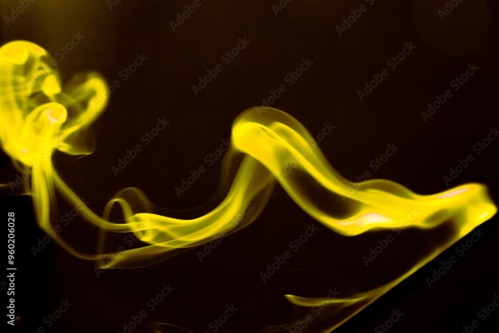 Illustration of yellow beautiful smoke on the black background Illustration of yellow beautiful smoke on the black background
