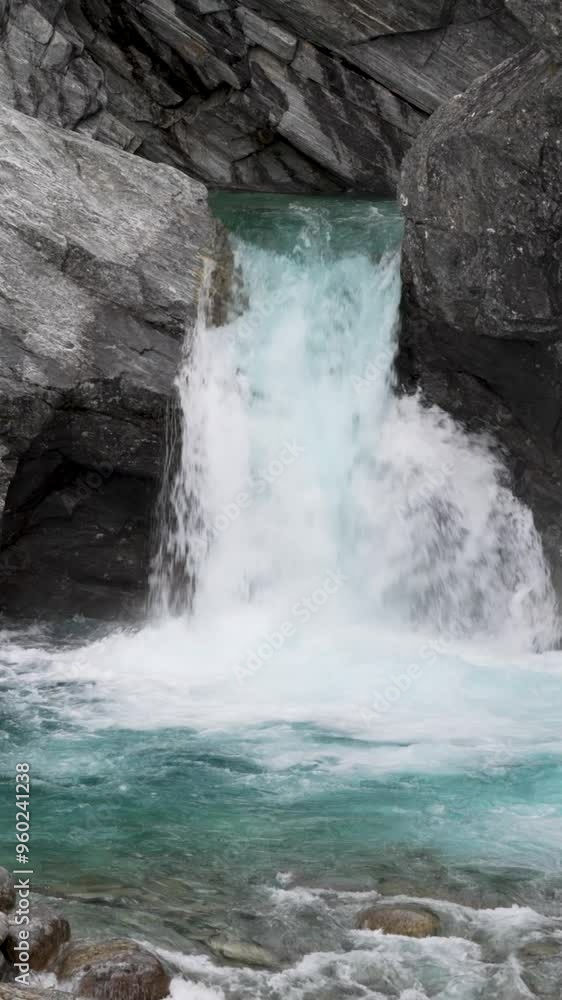 Vertical Slow motion of waterfall in pool at Billingen national reserve in Norway Vertical Slow motion of waterfall in pool at Billingen national reserve in Norway