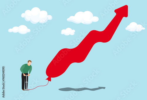 фотографія Inflation concept with man pumping air with bicycle pump into floating red upwar