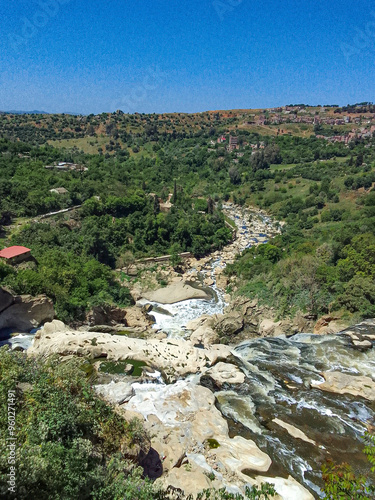 A stunning view of waterfalls and from under the suspension bridges of Constantine, Algerian city knonwn as Cirta in ancient times. photo