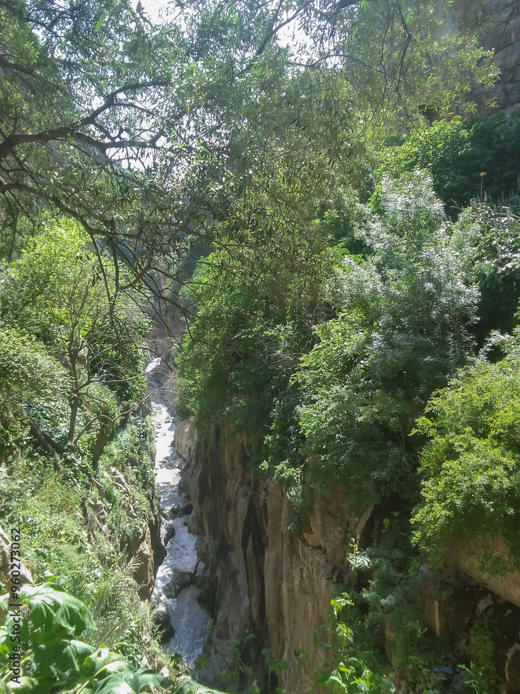 A stunning view of waterfalls and from under the suspension bridges of Constantine, Algerian city knonwn as Cirta in ancient times. A stunning view of waterfalls and from under the suspension bridges of Constantine, Algerian city knonwn as Cirta in ancient times.