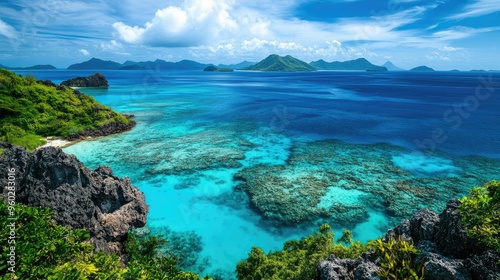 The stunning blue waters of the Mamanuca Islands with distant islands on the horizon.