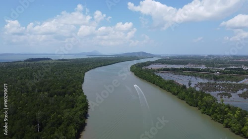 Wallpaper Mural A speedboat speeding through the waters of Kalimantan with views of the forest and winding rivers. Torontodigital.ca