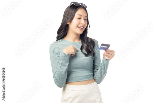 Happy young asian woman showing plastic credit card and looking at credit card with happy Standing at studio Customer girl get satisfied of credit card service with smile on face