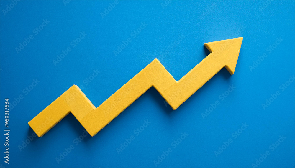 Yellow wooden arrow pointing upwards on blue background. Business and market growth concept Yellow wooden arrow pointing upwards on blue background. Business and market growth concept