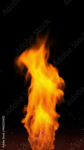 vertical video illustration of a torch flame and reddish yellow hot sparks isolated on black photo