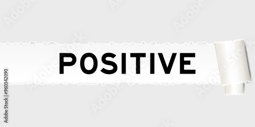 Ripped gray paper background that have word positive under torn part