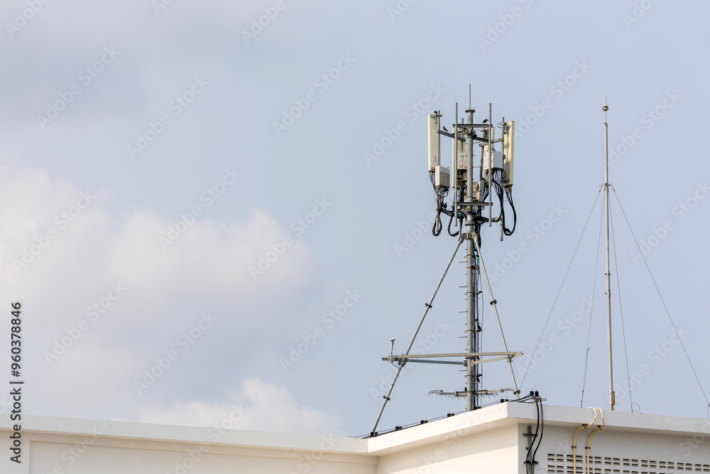 Communication tower top. Radio antenna Tower , microwave antenna tower on light sky background. wireless technology concept. communication development concept. image for objects and article. Communication tower top. Radio antenna Tower , microwave antenna tower on light sky background. wireless technology concept. communication development concept. image for objects and article.