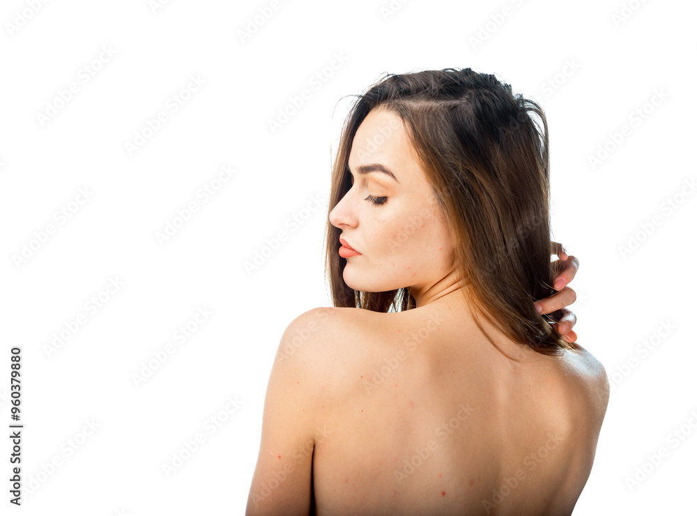Woman with long hair poses gracefully against a white background. A woman elegantly poses with her back to the camera Woman with long hair poses gracefully against a white background. A woman elegantly poses with her back to the camera